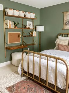 a bed room with a neatly made bed and a book shelf on the wall above it