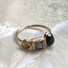 Top of the world This is a pretty 14K gold filled mothers ring. The band is set with three birthstones, in three sizes, Oval, square and round by choice or with the stones on the picture Onyx, labradorite and citrine. (R2613) For more info about gold filled please check our profile. Construction & Dimensions: 14K yellow gold filled, Onyx, labradorite and citrine. Approximate band width: 2.5mm please indicate your requested size in the order. About our jewelry All of artisanfield jewelry coll Birthstones Ring, Family Ring, Mothers Ring, Family Rings, Nugget Necklace, Mother Rings, Gold Filled Ring, Copper Rings, Spinner Rings