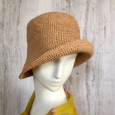 Crochet raffia hat It is a classic accessory for every woman for sun protection, summer parties, beach and travel. Can be a good gift for a woman of any age. The cap is crocheted from natural raffia, light, elastic, the brim of the cap is reinforced with wire. The hat keeps its shape well and does not fade in the sun. The cap is soft to the touch, slightly rough. It is fully crocheted. Easy to carry with foldable design. The hat is perfect for summer wardrobe. Field Size: about 3 inches Care of One Size Wide Brim Crochet Hat For Warm Weather, Casual Lightweight Crochet Fedora Hat, Lightweight Crochet Fedora Hat For Warm Weather, Crochet Hat With Short Brim For Warm Weather, Beige Brimmed Crochet Hat For Warm Weather, Casual Crochet Hat With Curved Brim For Warm Weather, Brimmed Woven Toquilla Straw Bucket Hat, Casual Crochet Hat With Short Brim In Natural Color, Natural Woven Fedora