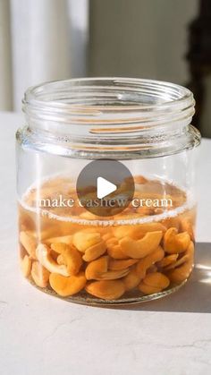 a jar filled with nuts sitting on top of a table