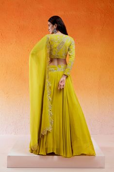 Featuring a daisy yellow lehenga set in georgette base with threadwork, cutdana and moti hand embroidery. It is paired with a matching embroidered georgette blouse and an organza dupatta. Yellow Palazzo Set With Intricate Embroidery For Diwali, Yellow Embroidered Palazzo Set For Diwali, Yellow Embroidered Palazzo Set For Wedding, Yellow Georgette Palazzo Set For Reception, Yellow Georgette Palazzo Set With Resham Embroidery, Yellow Resham Embroidery Palazzo Set In Georgette, Yellow Resham Embroidered Georgette Palazzo Set, Yellow Resham Embroidery Georgette Palazzo Set, Yellow Georgette Palazzo Set With Traditional Drape