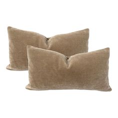 two brown pillows sitting on top of each other