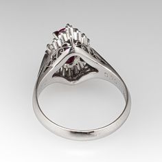 This fantastic ring centered with one (1) oval sapphire corundum that is four-prong set. Surrounding the center stone are six (6) round brilliant cut diamonds and ten (10) tapered baguette cut diamonds that are all prong set. The ring measures 15.1mm at the top, rises 8.9mm above the finger, tapering to 3.1mm wide and 1.0mm thick at the base of the shank. It is currently a size 5.75. Ballerina Ring, Baguette Cut Diamond, Baguette Cut, Sapphire Diamond, Round Brilliant Cut Diamond, Brilliant Cut Diamond, Pink Sapphire, Round Brilliant, Prong Setting