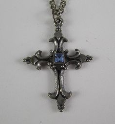 This ornate detailed cross pendant necklace touches on old world beauty and charm. Pewter is a very durable metal and should last decades. The chain is figaro style- 24 inches long . Cross pendant is  1 3/4" tall x 1 1/4" wide. Overall excellent vintage condition. Vintage Nickel-free Crucifix Necklace, Vintage Metal Cross Necklace, Vintage Nickel-free Crucifix Jewelry, Vintage Antique Silver Cross Pendant, Vintage Antique Silver Cross Necklace, Vintage Metal Crucifix Cross Necklace, Vintage Metal Cross Pendant Necklace, Vintage Silver Engraved Cross Necklace, Vintage Cross Shaped Metal Jewelry