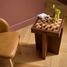 a chair and table with chess board on it