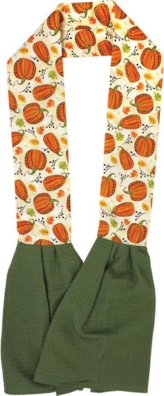 an orange and green scarf on top of a white background with pumpkins all over it