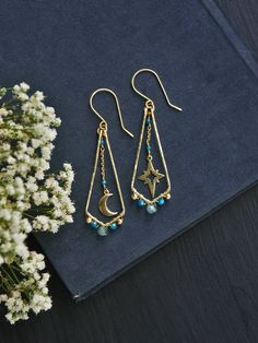 "This listing is for moon and star mismatched earrings in raw brass. These celestial earrings are a perfect witchy pair as they are super light weight. Made with three different shades and sizes of faceted apatite beads. Wire wrapped with utter most care out of raw brass, hammered for fun eye catching texture, polished to high shine. Perfect for casual everyday wear for anyone wanting a little bit of magic.  -⋄-⋄-⋄-⋄-⋄-⋄-⋄-⋄-⋄-⋄-⋄-⋄-⋄-⋄- ✧ ☾ MADE TO ORDER ☽ ✧ Production time is 1-5 Business Days Witchy Gifts, Celestial Earrings, Moon And Star Earrings, Earring Ideas, Mismatched Earrings, Celestial Jewelry, Moon And Star, Wire Earrings, Style Earrings