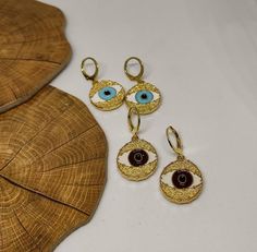 hoop earringsgold hoop earringsdangle earringshuggie hoop earringsclip on earringsgold evil eyeevil eye earringsgold earringsdrop earringsgift for hervintage earringsstatement earringseye earringsGold evil eye hoop earringsThis cute earrings are made from steell and they are 24k gold plated and handpainted.You can choose between 4 different clasps (the numbers 1 and 2 are for non pierced ears)They are very light and comfortable!Plus they are anti allergic/ nickel free ❤Evil eye meaningThe evil e Trendy Handmade Gold Plated Jewelry, Gold Evil Eye Drop Earrings, Brass Huggie Earrings For Gift, Brass Huggie Earrings As Gift, Fine Jewelry Metal Hoop Earrings As Gift, Brass Evil Eye Jewelry For Gifts, Evil Eye Brass Jewelry As A Gift, Sterling Silver Dangle Evil Eye Jewelry, Brass Evil Eye Jewelry As A Gift