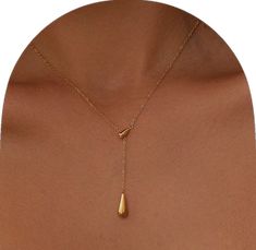 Minimalist Yellow Gold Drop Earrings, Modern Jewelry With Teardrop Pendant Clavicle Chain, Minimalist Teardrop Lariat Necklace With Adjustable Chain, Minimalist Long Drop Clavicle Chain Necklace, Minimalist Pear-shaped Drop Necklace, Minimalist Teardrop Drop Earrings As Gift, Minimalist Drop Necklace For Gift, Everyday Drop Necklace With Teardrop Pendant And Adjustable Chain, Minimalist Pear-shaped Gold Drop Necklace