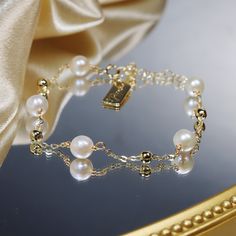 When it comes to the perfect gifts for your loved ones, look no further than this stunning Natural Freshwater Pearl Bracelet! Woven with care, this bracelet will add a touch of delicate luxury to any woman's wrist. Crafted with 14k gold plated metal, this bracelet features a minimalist temperament perfect for any occasion. A classic yet chic piece that brings just a hint of sparkle to any outfit, this pearl bracelet is sure to become her favorite jewelry staple! Whether she wears it casually or to an event, every girl will be sure to feel special. A timeless gift, this bracelet is great for any special occasion and can easily be added to any holiday wishlist. Bring a gentle shimmer to any ensemble with this beautiful and understated Natural Freshwater Pearl Bracelet! This effortless bracel Luxury Bracelets With Delicate Chain, Dainty Silver Bracelet With Pearl Chain, Elegant Rose Gold Plated Bracelets, Elegant Rose Gold-plated Bracelets, Dainty Rose Gold Plated Bracelet, Delicate Gold Bracelet As Gift, Dainty Gold-plated Bracelet For Gift, Elegant Handmade Gold Beaded Bracelets, Elegant Gold Handmade Beaded Bracelets