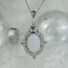 White Opal Pendant Jewelry, White Gold Moonstone Round Pendant Jewelry, White Gold Opal Necklace As Gift, White Gold Opal Necklace For Gift, White Oval Birthstone Jewelry, Oval White Birthstone Jewelry, White Birthstone Round Pendant Jewelry, White Gold Opal Jewelry As Gift, White Gold Opal Jewelry For Gift