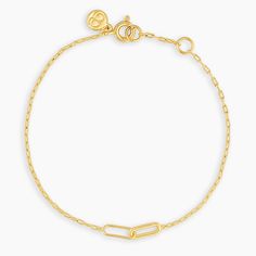 This paperclip chain bracelet features two cool interlocking links at its center. We love this easy bracelet worn alone or with the matching Zoey Necklace. Product Details 6 3/4" chain + 1/2" extender. Adjustable in 1/2 inch increments 6 3/4" - 7 1/4" Link charms measure 1/8" by 3/8" Spring ring closure Available in 18k gold plated brass Avoid contact with anything containing derivatives of alcohol | Zoey Bracelet in Gold, Women's by gorjana Timeless Gold Bracelets With Rectangular Links, Chic Yellow Gold Jubilee Bracelet, Chic 14k Gold Bracelets, Chic Everyday 14k Gold Bracelets, Chic 14k Yellow Gold Chain Bracelet, Elegant Yellow Gold Charm Bracelet With Cable Chain, Classic Gold Charm Bracelet With Jubilee Style, Classic Gold Charm Bracelet With Jubilee Bracelet, Classic Gold Charm Bracelet With Jubilee Detail