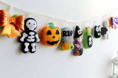 halloween decorations hanging on a clothes line in a child's room