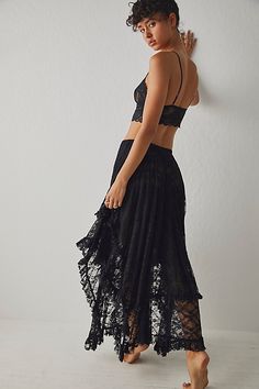 So lovely in lace, this sweet half-slip features an asymmetrical hemline and high-cut sides with ruffled detailing. **Fit:** Mid-rise, billowy silhouette, maxi-length **Features:** Pull-on style, smocked elastic waistband, asymmetrical hemline, lightweight lace fabrication, ruffled detailing throughout, high-cut sides, semi-sheer **Why We | French Courtship Half Slip by Intimately at Free People in Black, Size: L Free People French Courtship, Lacey Tops, Boho Skirt, Silk Bottoms, Free People Skirt, Half Slip, Floral Maxi Skirt, Lace Print, Ladies Dress