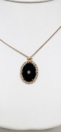 "The past will always return in the fashion world and this piece is back for round two! In the 1920's ladies of class wore the most opulent dresses with jewelry to match. As the years continued, jewelry makers tailored pieces to fashion and trends which resulted in affordability for style. Presenting this Beautiful Vintage 10k Gold Black Onyx Seed Pearl Pendant With Complimentary 10k Chain Necklace Featuring Elegant Twisted Rope Trim Designs. Approximate Size: Chain Measures 16.00\" Long, Pendan Elegant Black Curb Chain Jewelry, Black Medallion Necklace With Vintage Charm, Vintage Round Curb Chain Necklace, Elegant Medallion Necklaces With Curb Chain, Elegant Medallion Curb Chain Necklaces, Formal Onyx Oval Necklace, Vintage 14k Gold Necklaces With Curb Chain, Vintage 14k Gold Curb Chain Necklaces, Vintage 14k Gold Curb Chain Necklace