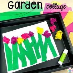 a black tray with flowers cut out of paper on it and the words garden collage