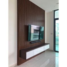 a flat screen tv mounted to the side of a wall