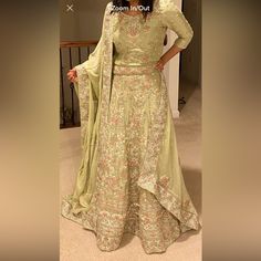 Intricately Embroidered Light Green Bridal Lehenga For Desi Wedding Occasions Worn Only To Show How It Looks Material: Silk Size: ~S To M (Will Update On Specifics Soon) Please Feel Free To Dm Me For More Details. Floral Embroidered Gown With Traditional Drape For Reception, Traditional Drape Gown With Floral Embroidery For Reception, Gown With Floral Embroidery And Traditional Drape For Reception, Pista Green Traditional Drape Gown For Reception, Elegant Green Lehenga With Floral Embroidery, Floral Embroidered Sharara With Traditional Drape For Wedding, Elegant Green Sharara With Floral Embroidery, Green Silk Choli For Wedding, Wedding Sharara With Dori Work For Transitional Season