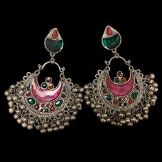 The Pink Gul Chandbali Earrings features intricate flower and peacock design on Oxidized Silver with multicolor crystals. The addition of ghungroos completes the look of this chandbali. Specifications Materials used: Oxidized Silver, Meenakari, Ghungroos At Romikas, we pride ourselves on the craftsmanship and high quality of our jewelry, designed to enhance your natural beauty. Please contact us with any questions. Traditional Multicolor Chandbali Hoop Earrings, Silver Jeweled Bollywood Chandbalis, Multicolor Chandbali Earrings With Intricate Design, Festive Multicolor Hoop Earrings, Multicolor Chandbali Chandelier Earrings, Multicolor Chandbali Jhumkas With Intricate Design, Multicolor Traditional Hoop Earrings With Latkans, Traditional Multicolor Hoop Earrings With Latkans, Traditional Multicolor Hoop Earrings For Festivals