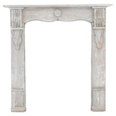 an old white fireplace with carvings on the top and bottom, isolated against a white background