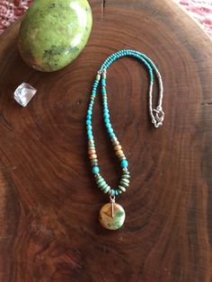 A very nice green turquoise disc dangles from 18 inches of beautiful blue and green turquoise stones with golden jasper accents. All the silver is Thai, which has a higher silver content than .925 Sterling Silver. Sterling Silver lobster clasp.