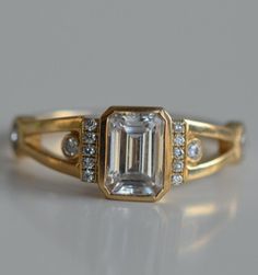 Art Deco Emerald Cut Ring Bezel Set Emerald Moissanite Engagement Ring Cluster Vintage Art Deco Emerald Rings, Art Deco 5 Stone Ring, 1920 Engagement Ring Vintage Art Deco, Tacky Engagement Rings, Emerald Cut Emerald Ring Gold, Vintage Bezel Set Engagement Ring, Unusual Gemstone Rings, Art Deco Wedding Stack, 2 Gemstone Ring