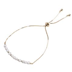 A delicate bracelet made from brass with a line of fresh water pears across the top of the wrist. The bracelet can be adjusted for fit. Delicate Adjustable Pearl Bracelet With Delicate Chain, Adjustable Delicate Pearl Bracelet With Chain, Luxury Delicate Pearl Chain Bracelet, Dainty Gold Plated Pearl Bracelet With Adjustable Chain, Elegant 14k Gold-filled Pearl Bracelet, String Of Pearls, Bracelet Sizes, Chain Link, Delicate Bracelet