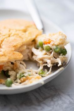 a white plate topped with chicken pot pie