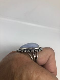 great color blue Lace agate stone The setting is handcrafted in low content silver About an inch long Size 7.5 Can be sized. My jeweler charges between $10-$15. All rings are shipped in a nice gift box. Check out our over a THOUSAND great reviews Engraving is $4 per letter and is not always perfect depending on the piece. It can take a few days if the jeweler is busy. This is payable to Paypal Judithsltd@gmail.com Formal Blue Handmade Gemstones, Blue Natural Stones Ring Gemstones, Blue Amethyst Ring Gift, Silver Opal Ring With Stones As Gift, Blue Gemstones Stamped 925 As Gift, Blue Opal Ring With Natural Stones, Oval Opal Ring Gift, Handmade Agate Moonstone Ring Gift, Handmade Silver Turquoise Ring For Formal Occasions