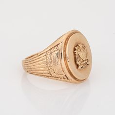 Finely detailed antique Victorian family crest signet ring (circa 1898), crafted in 10 karat yellow gold.   The oval signet mount features a family crest with the year '1898' to the base. The side shoulders feature a pretty etched foliate design. The low rise ring (3.5mm - 0.13 inches) sits comfortably on the finger.    The ring is in good condition with some wear evident. We have not cleaned it in order to preserve patina and collector value.   Particulars:  Weight: 13.5 grammes  Stones:  N/A Classic Formal Rings With Coat Of Arms, Formal Gold Signet Ring With Coat Of Arms, Classic Yellow Gold Engraved Ring With Coat Of Arms, Gold Oval Signet Ring With Coat Of Arms, 14k Gold Timeless Signet Ring Collectible, 14k Gold Timeless Signet Ring For Collectible, Timeless 14k Gold Signet Ring For Collectors, Formal Yellow Gold Engraved Ring With Coat Of Arms, Vintage Formal Coat Of Arms Jewelry