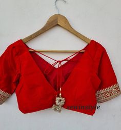 1. Fabric - Silk. 2. V NECK BLOUSE.  3. Elbow Sleeves Blouse. Traditional V-neck Wedding Blouse, Embroidered V-neck Wedding Blouse, V-neck Blouse Piece For Wedding Festivals, Red V-neck Blouse For Wedding, Elegant V-neck Padded Blouse Sets, V-neck Unstitched Blouse Piece For Wedding, Elegant V-neck Blouse For Navratri, Elegant V-neck Navratri Blouse, Bollywood Style V-neck Blouse For Wedding