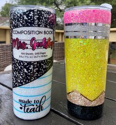 two glitter tumbles sitting next to each other on a table