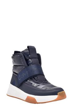 A logo-embellished strap adds sporty signature style to a high-top sneaker grounded by a chunky sole. Textile and synthetic upper/textile lining/leather sole Imported High Top Sneaker, High Top Shoes, Wedge Sneaker, Curator Style, Signature Style, Puma Sneaker, Womens Shoes Sneakers, High Top, Top Sneakers