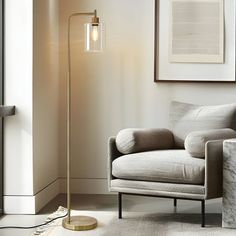 a living room scene with focus on the floor lamp