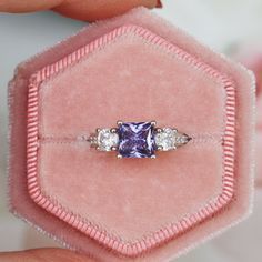 Gorgeous Princess Tanzanite Ring ►Made of sterling silver, rhodium plated (S925) ►Center stone: Tanzanite Color: Purple Gemstone Creation: Simulated Cut: Princess Gem size: 6.0 mm Carat Weight: 1.2 ct. (approx.) ►Accented with simulated diamonds (CZ) Cut: Round Gem size: 1.0 mm- 4.0 mm Color: Colorless ►Bands width: 2.4 mm ✓ 100% Nickel-Free ✓ Hypoallergenic ✓ Comfort Fit ✓ Free Ring Box ✓ Free USA Shipping ✓ Ready to ship next business day Etsy Engagement Rings, Tanzanite Ring, Sterling Silver Engagement Rings, Gemstone Engagement, December Birthstone, Fine Jewelry Collection, Anniversary Gift For Her, Ring Sterling Silver, Unique Engagement Rings