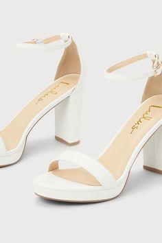 There's nothing you'll love more than how you look in the Lulus Kinsella White Platform Ankle Strap High Heels! These essential heels have a smooth faux leather composition that shapes an almond-shaped toe bed (atop a 0.50"" toe platform) and a slender toe strap. A sturdy heel cup supports a matching adjustable ankle strap that secures with a shiny gold buckle, all atop an eye-catching block heel. 3. 75" wrapped block heel. Cushioned insole. Upper Material: Synthetic. Sole Material: TPR. Man mad White Faux Leather Heels With Block Heel, White Ankle Strap Heels In Faux Leather, White Faux Leather Heels With Stacked Heel, White Stacked Heel Heels In Faux Leather, White Faux Leather Heels With 4-inch Heel, Synthetic Almond Toe Heels With Heel Strap, Synthetic Heels With Stacked Heel And Almond Toe, White Platform, Ankle Strap High Heels