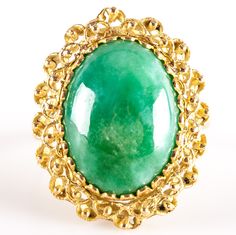 18k Yellow Gold Oval Cabochon Jade Solitaire Cocktail Ring 6.38gMetal Information: 18k Yellow GoldTotal Weight: 6.38gBand Width: 1.95mmSize: 6.5Stone InformationMain StoneGem Type: JadeShape: Oval Cabochon (16mm x 12mm)Color: GreenClarity/Quality: ANumber of Stones: 1Estimated Retail Price: $2005.00OUR PRICE: $1600.00SizingMany of our pieces can be re-sized at the buyers request. Please email us if you require our skilled professional services.45683 Heirloom Gold Emerald Ring With Oval Cabochon, Yellow Gold Gemstone Cabochons, Gold Domed Gemstone Cabochons, Domed Gold Gemstone Cabochons, Oval Cabochon Opal Ring In Fine Jewelry, Oval Cabochon Opal Ring Fine Jewelry, Fine Jewelry Oval Cabochon Opal Ring, Oval Cabochon Emerald Ring Gift, Oval Yellow Gold Cabochons For Formal Events