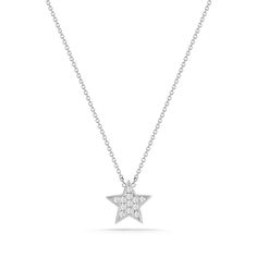 We're seeing stars! Our Julianne Himiko gold and diamond star necklace is what celestial dreams are made of. This single star pendant is adorned with pavé-set diamonds and hangs on a delicate diamond cut cable chain. Delicate and dainty, this charming necklace is perfect for layering. This is the must-have piece for all the Astrology lovers out there. It is available in 14k white, yellow, and rose gold with a spring-ring clasp and a sparkling mini-chain. The pendant is always white gold to show Fine Jewelry White Gold Necklace With Star Charm, Diamond Star Charm Pendant Necklace, Star-shaped Diamond White Necklace With Single Cut Diamonds, White Gold Star Necklace Fine Jewelry, Diamond Star Charm Necklace, Star-shaped Diamond Necklace With Single Cut Diamonds, Star Shaped Diamond Necklace With Single Cut Diamonds, Dainty Star Diamond Necklace, Dainty Diamond Star Necklace