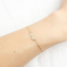 "So dainty and so sweet 14k gold bracelet. This heart double initial bracelet is perfect jewelry to show love and affection. Will make a perfect gift, or buy one for yourself to keep special someone's initial closer to your heart. This subtle and simple style will also make a great addition to your layering bracelet. * Engraving & Font: Choose your font from the font reference photo above and your two initials to \"note\" during checkout. Script font is by default if not chosen. Engraving wi Dainty Personalized Name Bracelet For Anniversary, Dainty Sterling Silver Name Bracelet For Mother's Day, Dainty Rose Gold Name Bracelet In Sterling Silver, Personalized Dainty White Gold Name Bracelet, Dainty Personalized White Gold Bracelets, Dainty Personalized White Gold Name Bracelet, Personalized White Gold Dainty Name Bracelet, Dainty Rose Gold Bracelets For Personalized Gift, Personalized Dainty Sterling Silver Chain Bracelet