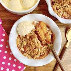 three bowls filled with dessert on top of a wooden table