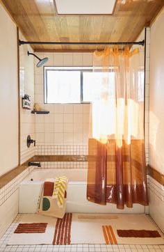 a bath room with a tub and a shower curtain