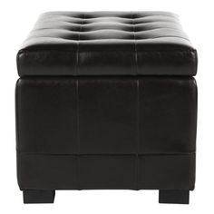 a black leather ottoman sitting on top of a white floor