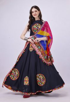 Celebrate Navratri in style with our stunning Black Chaniya Choli ensemble, thoughtfully designed for this festive season. Crafted from luxurious rayon cotton fabric, this sleeveless Choli and Chaniya exude elegance and comfort. What sets our Chaniya Choli apart is the meticulous attention to detail. Authentic garba laces adorn the entirety of the outfit, infusing it with the vibrant spirit of the Garba dance. Each patch of lace is a nod to the rich tradition of Navratri celebrations. To complete the look, we've included a colorful dupatta that adds the perfect finishing touch to your ensemble. Whether you're dancing the night away or participating in Navratri festivities, our Black Chaniya Choli is the epitome of grace and style. Embrace the joy of Navratri with this exquisite outfit. Ord Black Chaniya Choli, Bridesmaids Indian, Chaniya Choli For Navratri, Designer Chaniya Choli, Choli For Navratri, Garba Chaniya Choli, Garba Outfit, Garba Dress, Navratri Dress