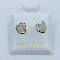 14k Gold earrings heart ❤️ girl or women studs  ❤️ Yellow gold with white or pink cubic zirconia 6mm  ❤️ screw back    ❤️ Includes a box  Check out my other jewelry  ❤️ aretes de corazón de 6 milímetros  ❤️ Tornillo  ❤️ Incluye Cajita ❤️ Oro de 14 Kilates  ❤️ broqueles  ❤️ Piedra blanca o rosa zirconia Gold Heart Earrings Diamond Cut Gift, 14k Gold Screw Back Earrings For Anniversary, Gold Heart Cut Earrings With Prong Setting, Gold Screw Back Round Cut Jewelry, Gold Heart Jewelry With Prong Setting, Gold Heart Shaped Jewelry With Prong Setting, Dainty 14k Gold Jewelry With Screw Back, Gold Heart Earrings With Prong Setting For Valentine's Day, Gold Heart Earrings For Valentine's Day With Prong Setting