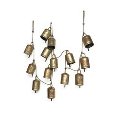 six brass bells hanging from the ceiling