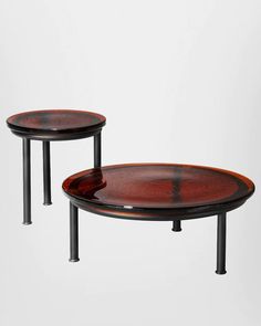 two wooden tables sitting next to each other on top of a white surface with black metal legs