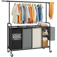 an ironing rack with clothes hanging on the rail and two bins below it