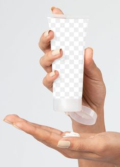 two hands holding a white container with cream on it and one hand reaching out to the other