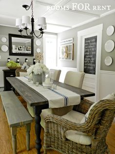 a dining room table with chairs and a bench