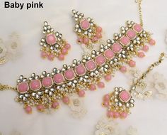 *Light Weight Gold maroon, green , dark pink Kundan Choker Adjustable necklace set with earrings and tikka. *Studded with kundan stone. *Necklace width- 2 inches (included pearl drop) *Earrings Length- 2.4 inches(included pearl drop) *Breadth- 1.3 inches Bollywood Style Pink Kundan Tikka, Festive Pink Kundan Tikka, Pink Stone Work Tikka For Festive Occasions, Pink Kundan Tikka For Diwali, Bollywood Style Pink Tikka With Stone Work, Pink Hand Set Bridal Necklace For Party, Pink Tikka For Diwali Party, Pink Bollywood Style Tikka As Gift, Pink Hand-set Bridal Necklace For Party